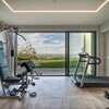 Private Gym with Technogym Equipment Villa Olivo Photo credit Davide Bischeri.