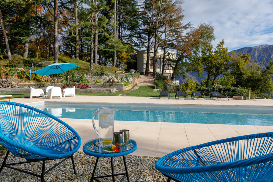 Villa Ponti Bellavista villa from arbour blue chairs